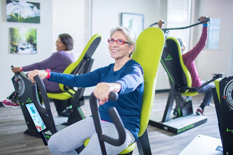 Older adults using senior-friendly strength training equipment to support healthy aging and brain health.