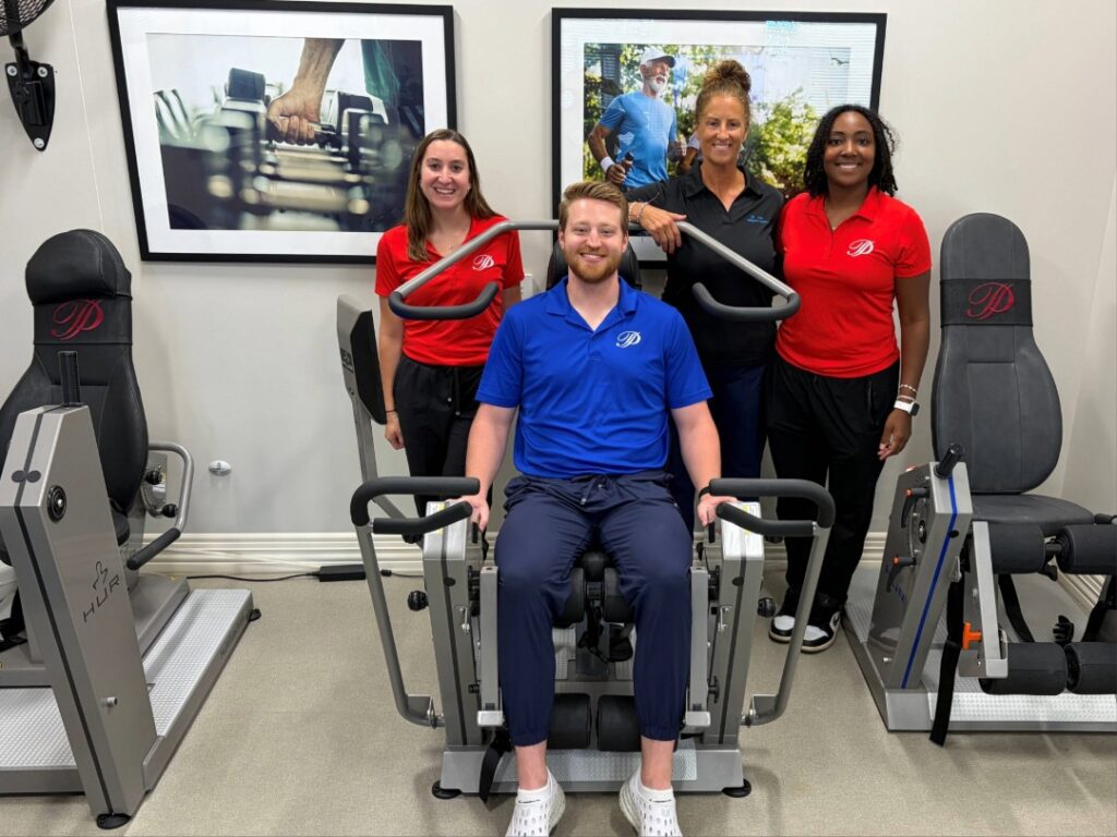 Plymouth Place fitness team with HUR strength training equipment